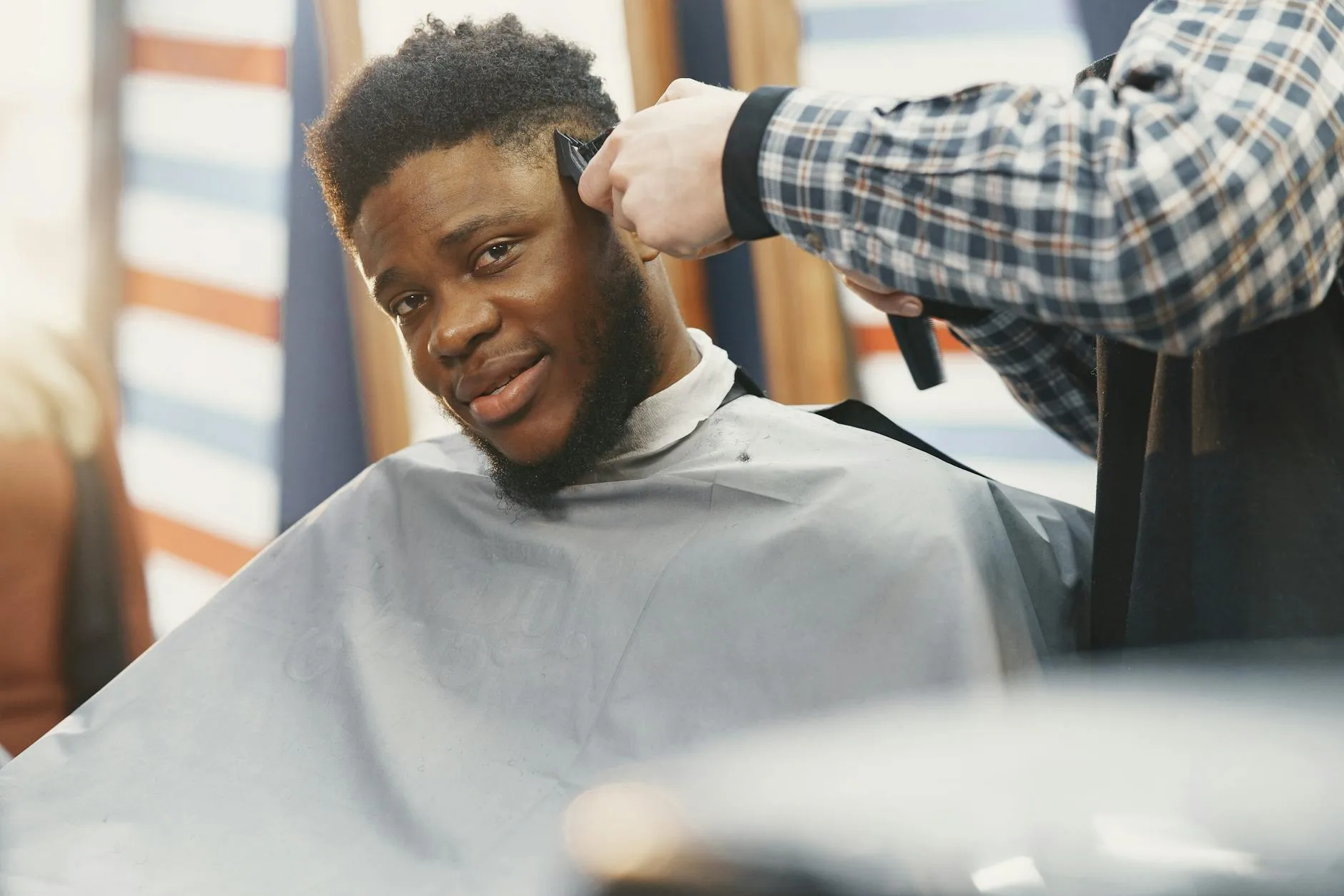 Barber performing straight razor shave