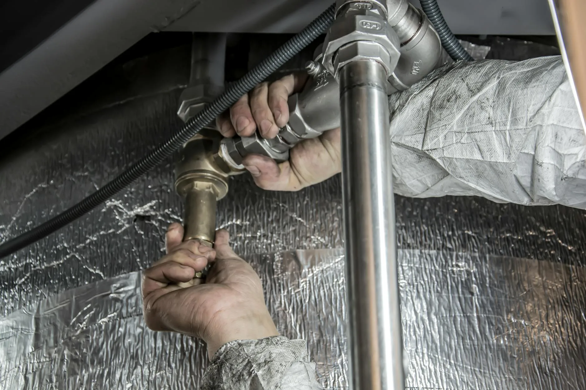 Plumbing student working on pipe installation