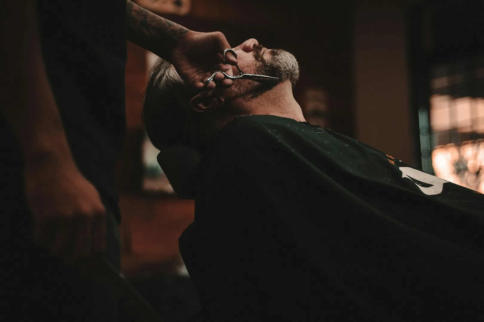 Barber apprentice demonstrating a supervised technical skill