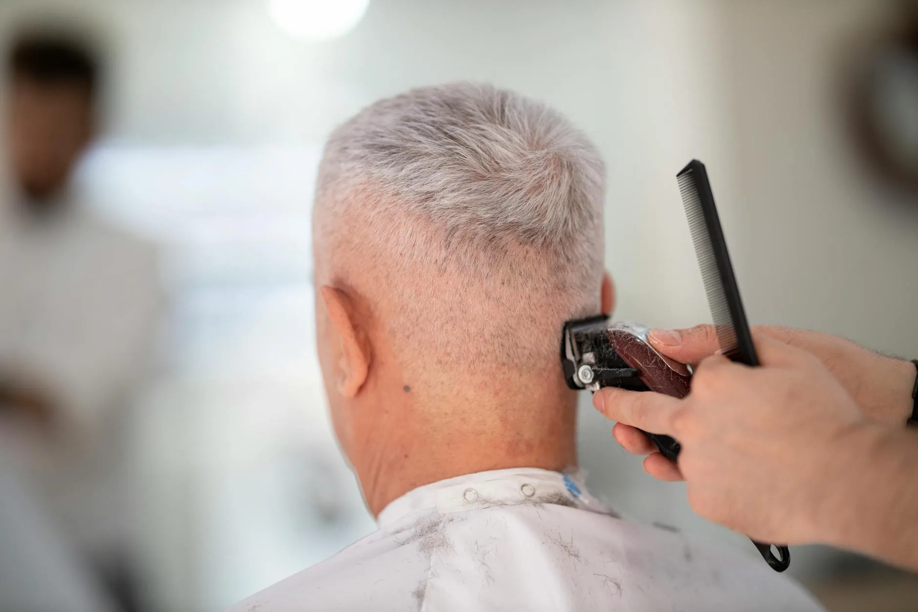 Barber performing a straight razor shave