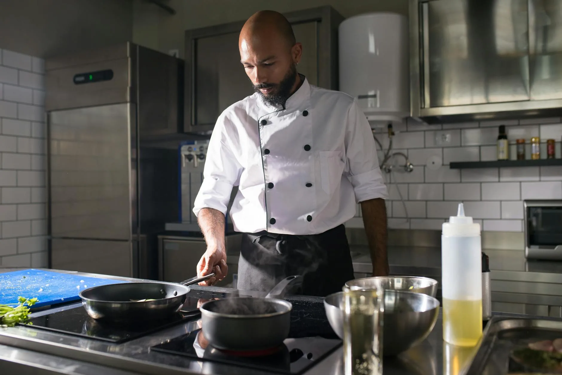 Culinary apprentice preparing food in a professional kitchen