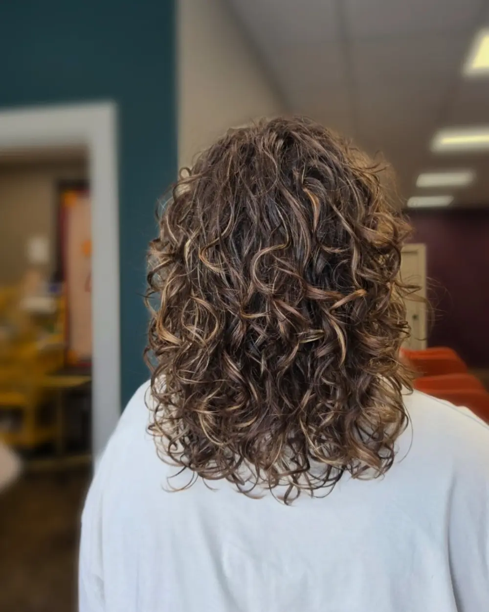 Highlighted dimensional curls created by Generations Hair LLC