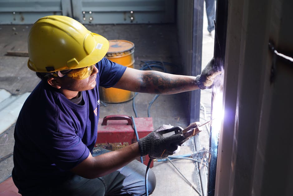 Manufacturing technician working with industrial production equipment